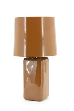 a table lamp with a brown shade on it's base and a white background