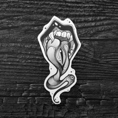 a sticker that is on the side of a wooden wall with an image of a mouth