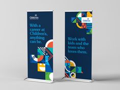 two roll up banners with the words work with kids and the team who loves them