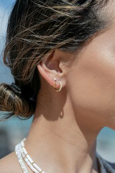 Add the prettiest white fire opal open hoop earrings to sweeten your earlobes. These tiny "claw" hoops are perfect paired with any of our other favorite hoop earrings. ✦ DETAILS ✦✧ Name: Kalino (kah LEE no) - bright one.✧ You will receive 1 pair.✧ Size: 10mm outer diameter; 8.5mm inner diameter.✧ Gold Plated Sterling Silver.✧ 3mm Synthetic White Fire Opals.✧ All Ke Aloha Jewelry pieces come packaged thoughtfully, beautifully, and ready for gift giving. Fire Opals, Gemstone Hoop Earrings, Small Gold Hoops, Iridescent White, Tiny Hoop Earrings, Open Hoop Earrings, Gold Filled Hoops, Huggie Hoop Earrings, Cuff Earrings