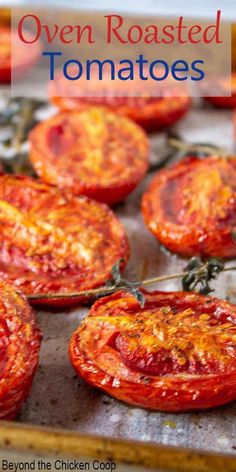 oven roasted tomatoes on a baking sheet with text overlay that reads oven roasted tomatoes