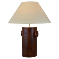 a table lamp with a wooden base and white shade on the top, sitting in front of a white background