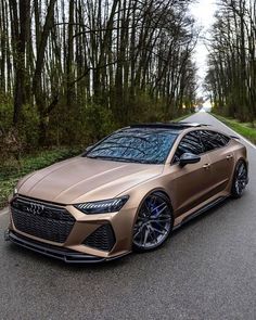 an image of a car that is driving down the road with trees in the background