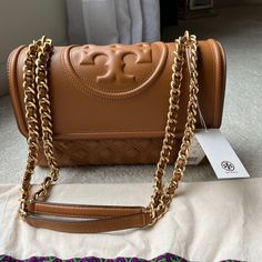 Lovely Quilted Bag With Convertible Shoulder Strap. Strap Is Leather Woven With Brushed Gold Hardware. The Bag Comes With Dust Bag And Retail Tags Attached. Never Worn. Tory Burch Bucket Bag, Tory Burch Clutch, Brushed Gold Hardware, Tory Burch Purse, Tory Burch Wallet, Tory Burch Tote, Slim Leather Wallet, Leather Saddle Bags, Tory Burch Handbags