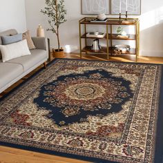 a living room filled with furniture and a large rug on top of a hard wood floor