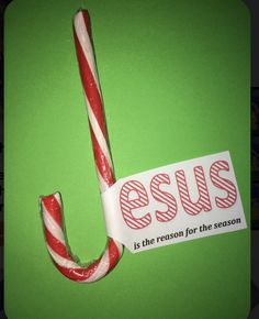 a candy cane with the words jesus is the reason for the season