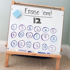 a white board with numbers written on it