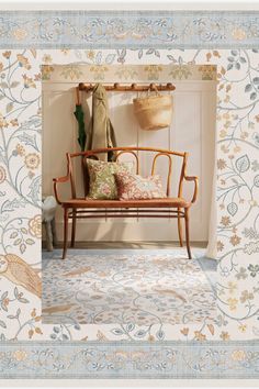 a wooden bench sitting in front of a white wall with flowers on it's border