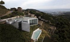 an aerial view of a house on top of a hill