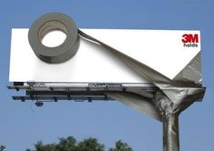 a billboard with a roll of tape on it