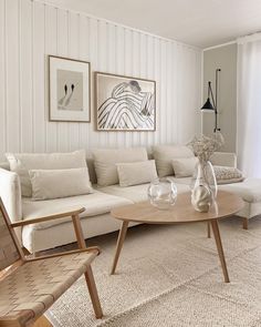 a living room filled with furniture and white walls