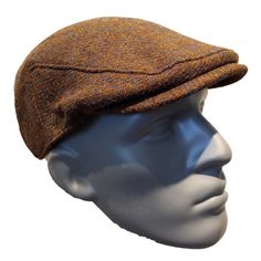 a mannequin head wearing a brown hat