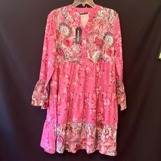 Loses Fitting Breezy Fun Flowery Dress With Flared Sleeves. New With Tags Size Small But Could Easily Fit A Size 10. Pink Flowy Boho Dress With Floral Print, Pink Boho Dress With Floral Print, Spring Floral Print Tunic Dress, Floral Print Tunic Dress For Spring, Pink Tunic Boho Dress For Spring, Red Bohemian Floral Dress For Spring, Pink Bohemian Floral Printed Dress, Pink Paisley Print Dress For Spring, Pink Flowy Floral Dress For Fall