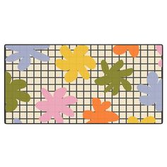 an area rug with flowers on it and a checkered background in multicolors