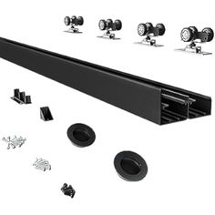 an assortment of black hardware and accessories including wheels, knobs, and screws