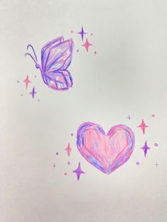 two butterflies flying next to a pink heart and star shaped object on a white surface