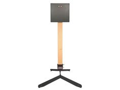 a wooden stand with a speaker on it's back end and two black legs