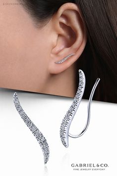 Smoothly curved and tapered 14k white gold climber earrings adorned with 0.23cts of shimmering French pavé diamonds make a striking and stylish accessory. This trendy ear climber style is a modern way to flaunt diamond earrings for day or night. EG12939W45JJ #GabrielNY #DiamondJewelry #FineJewelry #GabrielAndCo #UniqueJewelry #Jewelry #FashionJewelry #GiftIdeas #UniqueGifts #Earrings #FashionEarrings #WhiteGoldEarrings #WhiteGoldFashionEarrings #GoldEarrings #GoldFashionEarrings #Graduations #Gr Earrings Fine Jewelry, Crawler Earrings, Desain Pantry, Womens Jewelry Trends, Gold Bridal Necklace, Ear Crawler, Art Jewelry Design, Mens Rings Fashion, Arm Bracelets