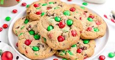 a white plate topped with cookies covered in candy