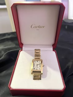 This rare special order Cartier Lady's Tank Française wristwatch is a luxurious timepiece made of 18K solid gold, weighing a total of 78.34 grams. The Swiss-made watch features a solid case-back, quartz movement, and is customized for a unique touch. Crafted by one of the world's most renowned luxury brands, this Cartier Tank model is a rare timeless piece that exudes elegance and sophistication. The watch is designed for women and is perfect for formal occasions or adding a touch of luxury to e Gold Watch Cartier, Cartier Gold Watch Women, Cartier Tank Gold, Branded Watches Women Luxury, Cartier Womens Watch, Cartier Tank Watch Woman, Cartier Gold Watch, Luxury Watches Women, Wrist Watches For Women