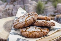 some cookies are sitting on top of a napkin