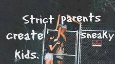 two people standing on the side of a fence with words over them that read, strict parents create sneaky kids