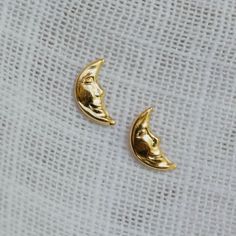 The daintiest left-facing crescent moon stud, Artemis. - 14k gold filled - Crescent moon stud, 9mm post Click here to view our shop policies, including our current processing times and more shipping information. Moon Studs, Crescent Moon, Shop Policies, Crescent, Gold Filled, Lookbook, Chicago, Moon, Gold