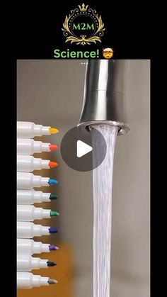 a faucet with water running out of it and colored markers on the side