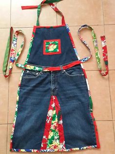 a child's apron made out of old jeans and other items on the floor