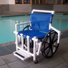 a wheelchair sitting next to a swimming pool