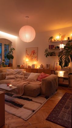 a living room filled with lots of furniture next to a fire place and potted plant