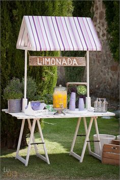 a picnic table with lemonade and juice on it