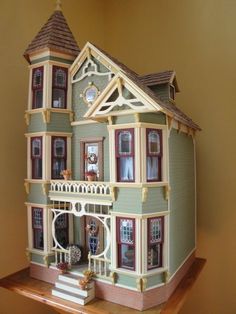 a doll house is sitting on a shelf