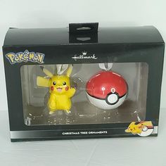 two pikachu figurines are in the box