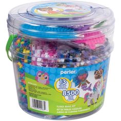 a plastic container filled with assorted beads and other crafting supplies for kids to make