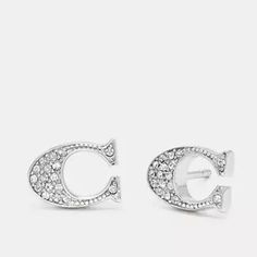 Coach Signature Stud Earrings New In Packaging Style Number F29824 Measurements Length: 0.5" Height: 0.25" Materials Plated Brass