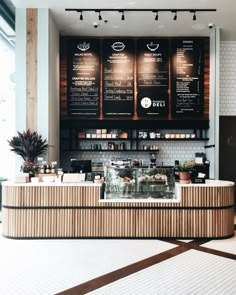 the inside of a coffee shop with menus on the wall