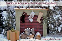 a fireplace with stockings hanging from it in the snow