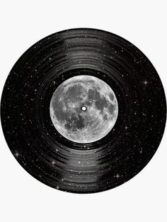 an old record with the moon in it's center and stars all over it