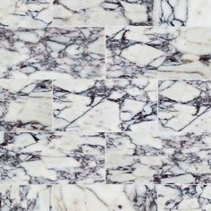 an image of marble tile that looks like it is being used for wallpaper or flooring