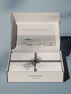 an open gift box with a card inside