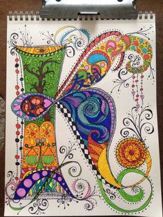 an art journal with colorful designs on it