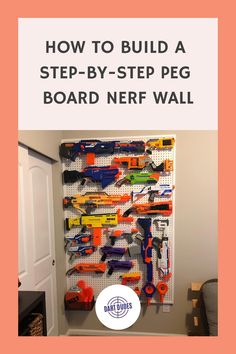 A colorful assortment of Nerf guns organized on a large pegboard wall, with a title above reading "How to Build a Step-by-Step Peg Board Nerf Wall". Peg Board Nerf Wall Diy, Peg Board Toy Storage, Nerf Pegboard Wall, Diy Nerf Storage, Peg Board Nerf Wall, Peg Board Ideas, Nerf Wall, Pegboard Baskets