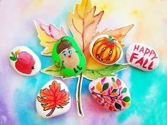 an image of fall decorations made out of leaves and acrylic paint on watercolor paper