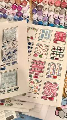 several sheets of paper with different designs on them