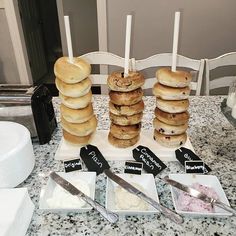 a table topped with lots of donuts and other desserts on top of it