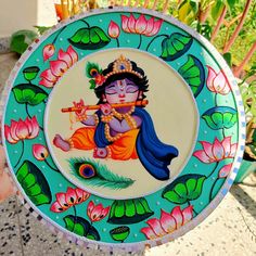 a colorful plate with a painting of a person holding a flute in it's hand