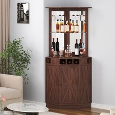 a living room filled with furniture and a wine rack on top of a wooden cabinet