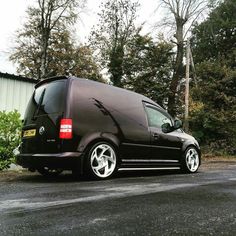 a black van parked on the side of a road