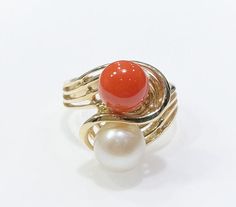 Aloha and welcome to our online store! For Sale: Brand New Genuine Natural Hawaiian Red Coral and Akoya Pearl 14k Yellow Gold Ring Coral is genuine untreated harvested from the Mid-Pacific Ocean Sphere shaped coral cabochon measures approximately:  7.88 mm in diameter Genuine natural Akoya pearl measures approximately 8.00 mm in diameter Solid 14 karat yellow gold Ring top width:  17.00 mm wide Ring bottom band width: 3.37 mm Ring size: 6.75 Total ring weight:  5.80 grams Ring can be resized-- p Wide Ring, Etsy Gold Ring, Wide Rings, Akoya Pearls, Yellow Gold Ring, Pacific Ocean, Red Coral, Pearl Ring, Yellow Gold Rings